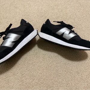 New Balance Women’s  Black and Silver Sneakers